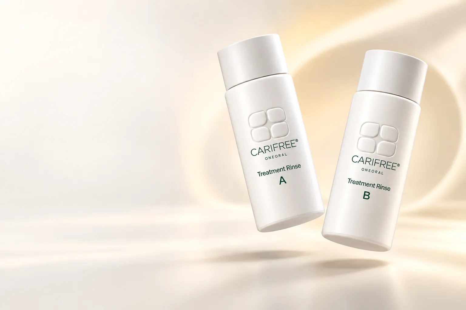 White CariFree-branded Treatment Rinse A and B bottles with small ONEORAL wordmarks floating in warm ivory light