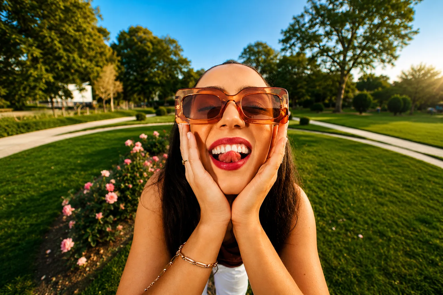 A smiling woman enjoying a sunny day outdoors