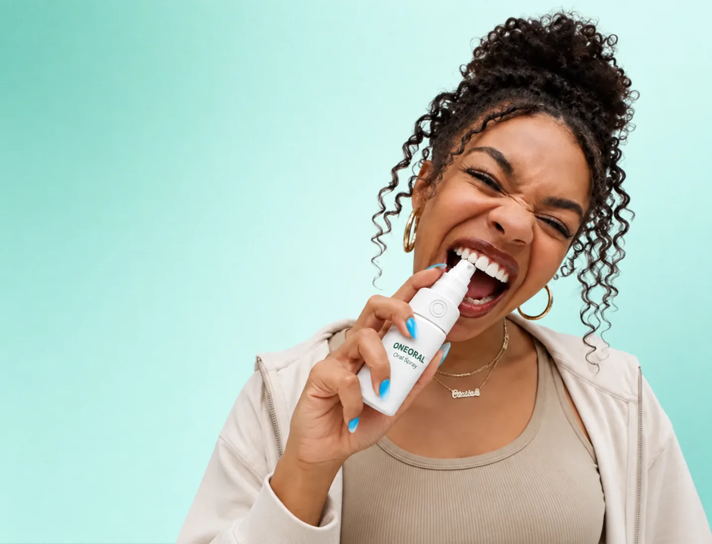 A woman using moisturizing oral spray