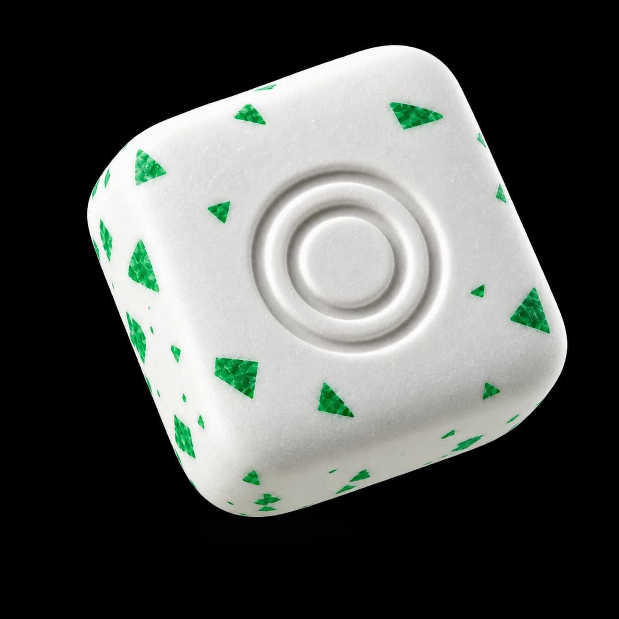 White rounded-square gum piece with green mint flecks and an embossed double-ring logo