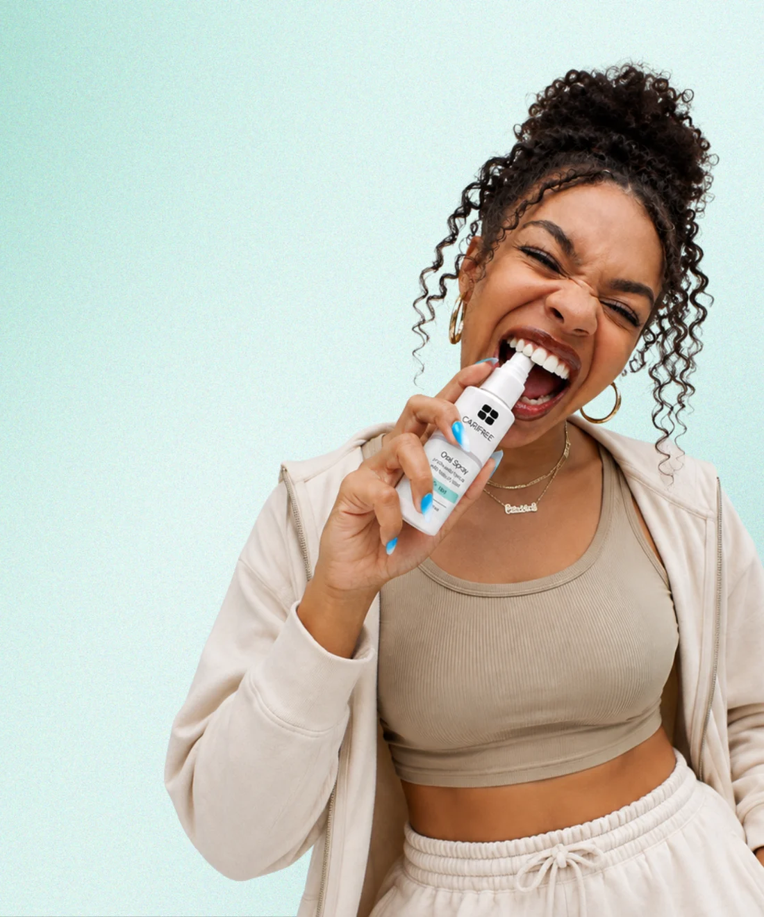 A OneOral member using the moisturizing oral spray