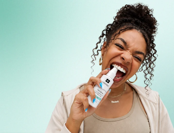 A OneOral member using the moisturizing oral spray