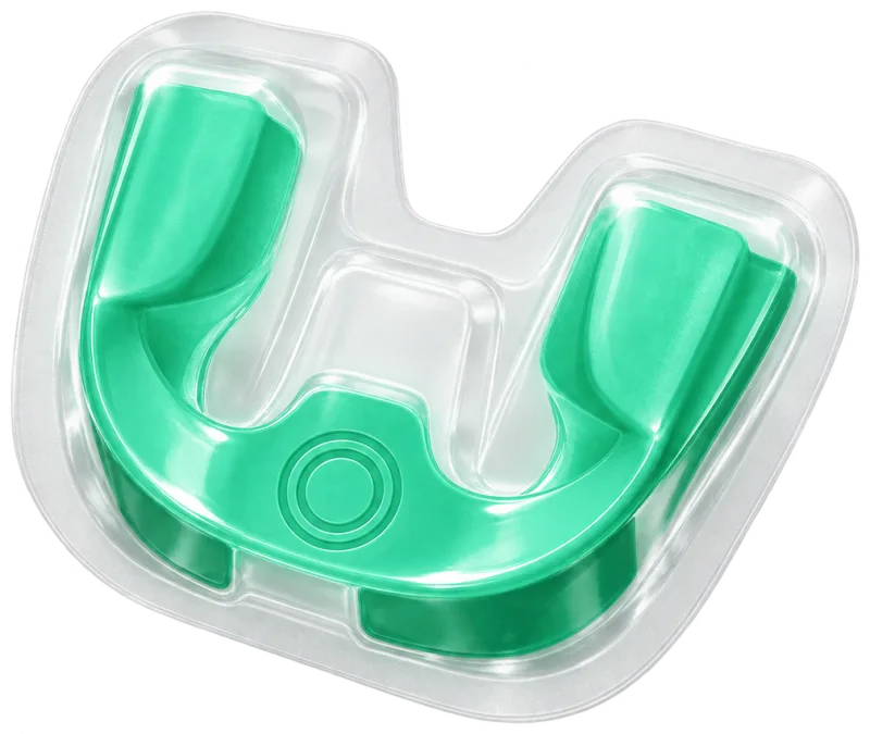 A mint-green whitening tray sealed in its blister pack, the OneOral ring pressed into it